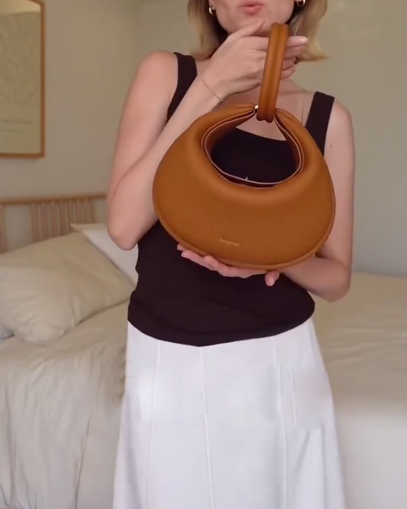 Effen kleur elegante halvemaanvormige schoudertas onder de arm
