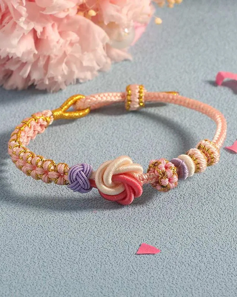 Armband met knoop van perzikbloesems