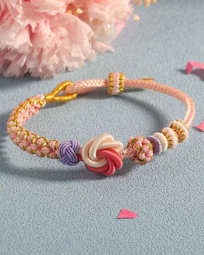 Armband met knoop van perzikbloesems