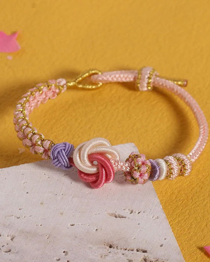 Armband met knoop van perzikbloesems