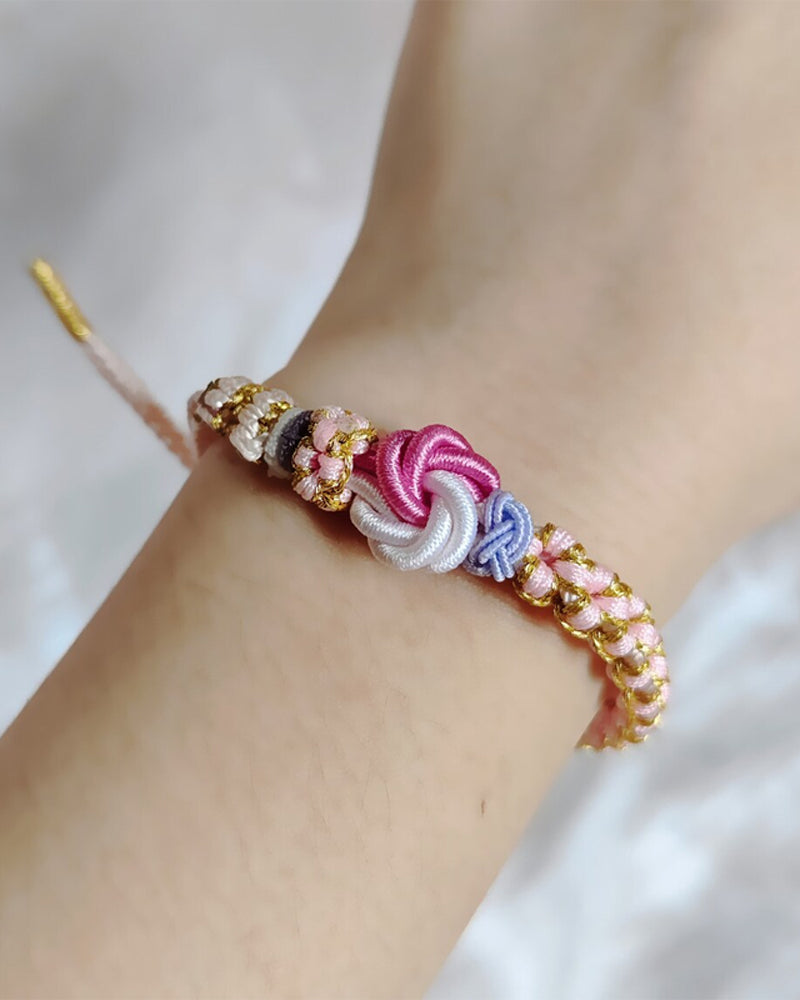 Armband met knoop van perzikbloesems