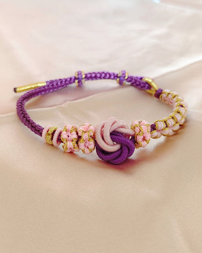 Armband met knoop van perzikbloesems