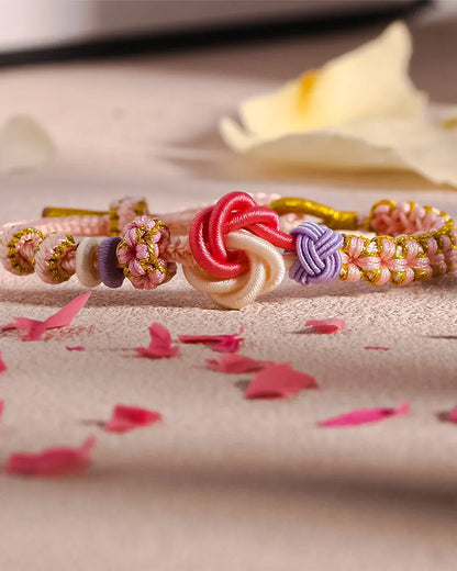 Armband met knoop van perzikbloesems