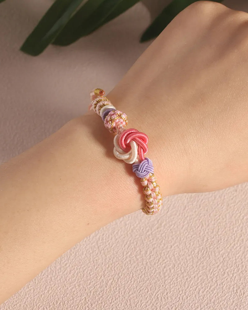 Armband met knoop van perzikbloesems
