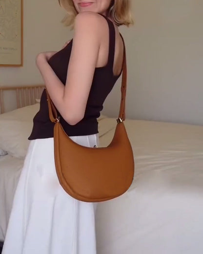 Effen kleur elegante halvemaanvormige schoudertas onder de arm