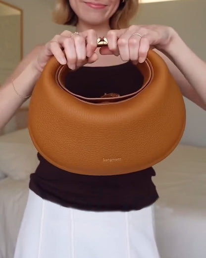 Effen kleur elegante halvemaanvormige schoudertas onder de arm