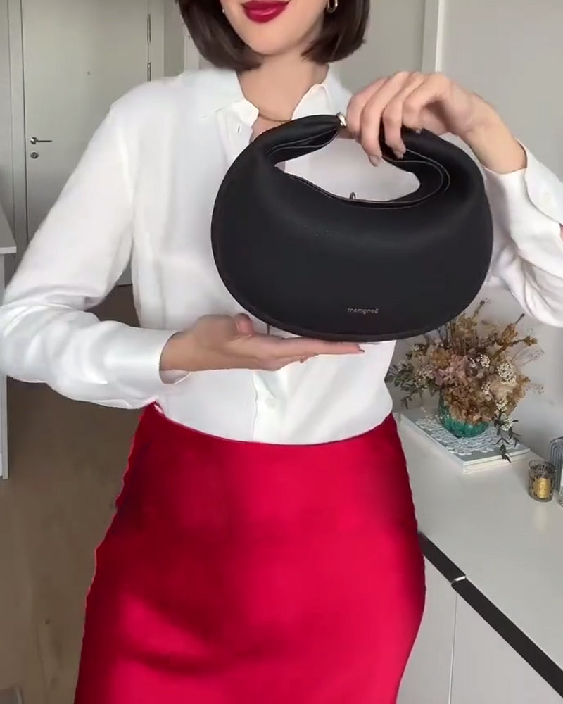 Effen kleur elegante halvemaanvormige schoudertas onder de arm